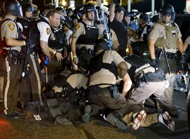 police detain a protester in ferguson missouri august 10 2015 photo reuters police detain a protester in ferguson missouri august 10 2015 photo reuters