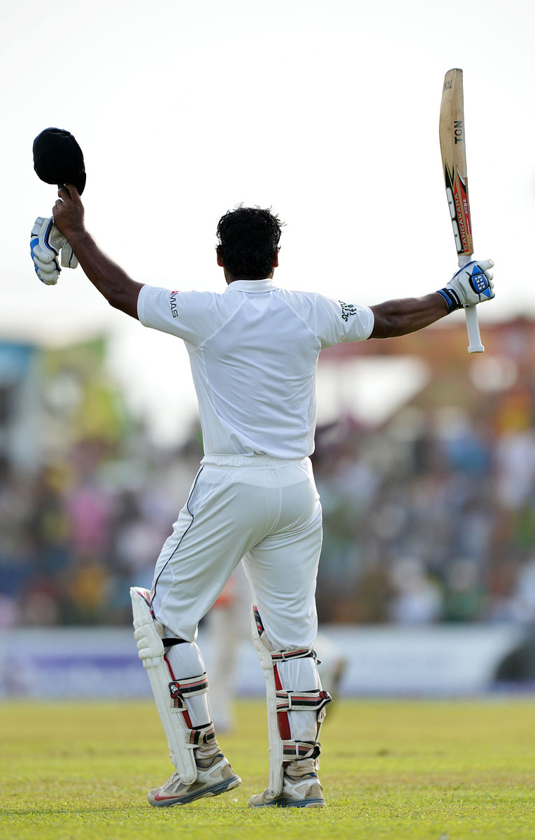 sri lankan cricketer kumar sangakkara gestures as he leaves the field after being dismissed at 221 runs during the fourth day of the opening test match between sri lanka and pakistan at the galle international cricket stadium in galle on august 9 2014 photo afp