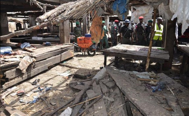 policemen inspect the site of a suicide attack at a busy cattle market in nigerian city of maiduguri on tuesday photo afp policemen inspect the site of a suicide attack at a busy cattle market in nigerian city of maiduguri on tuesday photo afp