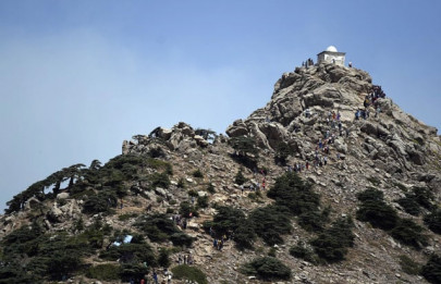 pilgrims cast prayers to the skies from algeria mountain peak