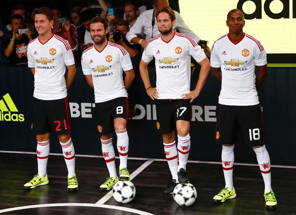 from l manchester united 039 s ander herrera juan mata daley blind and ashley young pose in the new adidas away kit at a launch event in london on august 11 2015 photo afp