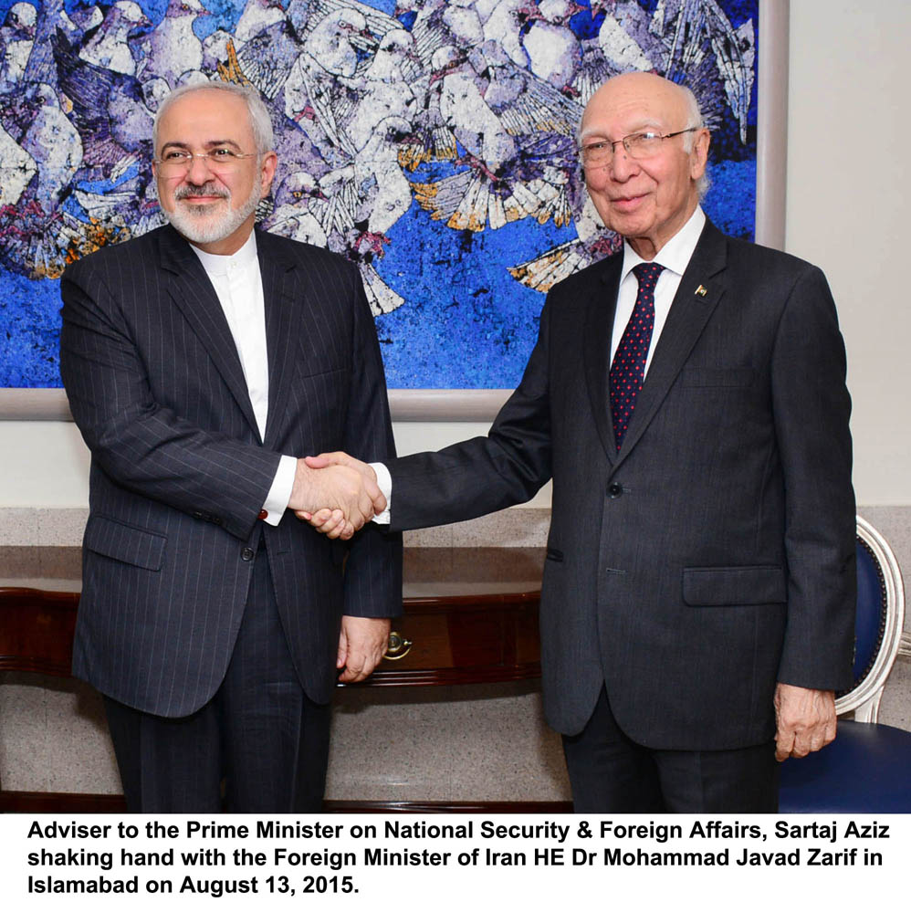 adviser to prime minister on national security and foreign affairs shakes hands with iranian foreign minister javad zarif in islamabad on august 13 2015 photo pid