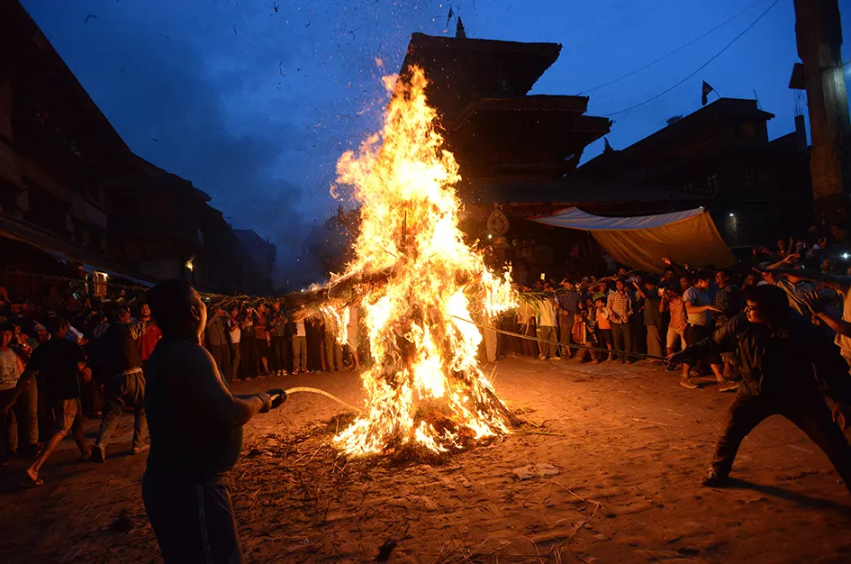 nepalese devotees watch as a straw effigy of ghanta karna burns during celebrations of the hindu festival of quot gathemangal quot also known as ghanta karna in bhaktapur on the outskirts of kathmandu on august 12 2015 the nepalese festival which celebrates the defeat of the mythical demon ghanta karna quot bell ears quot is celebrated by performing the legendary drama in the streets photo afp