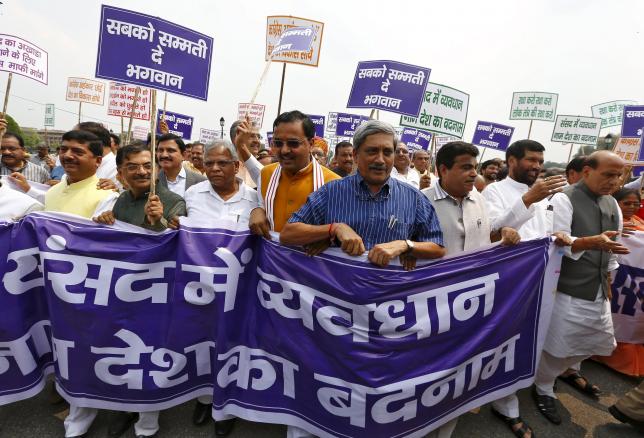 defence minister manohar parrikar c in blue along with lawmakers from the ruling bharatiya janata party bjp and its allies take part in what they say is a 039 039 save democracy 039 039 march outside parliament in new delhi august 13 2015 photo reuters