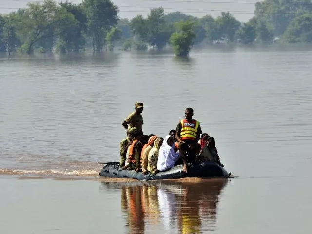 soldiers use an inflatable boat to rescue flood affected residents from a village in punjab photo afp soldiers use an inflatable boat to rescue flood affected residents from a village in punjab photo afp