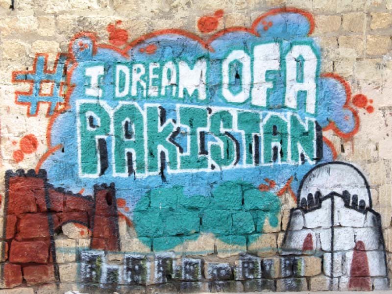 abdoz arts and their graffiti artists have painted patriotic symbols on 10 walls of the city that will be filled with people s responses of what they dream pakistan to become in the future photo aysha saleem express