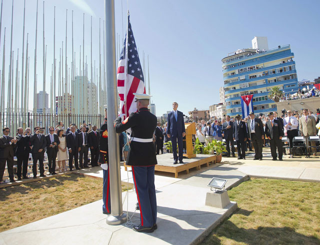 us secretary of state john kerry c stands with other dignitaries as members of the us marines raise the us flag over the newly reopened embassy in havana cuba on august 14 2015 kerry is at the cuban capital to raise the us flag and formally reopen the long closed us embassy cuba and the us officially restored diplomatic relations july 20 as part of efforts to normalize ties between the former cold war foes photo afp