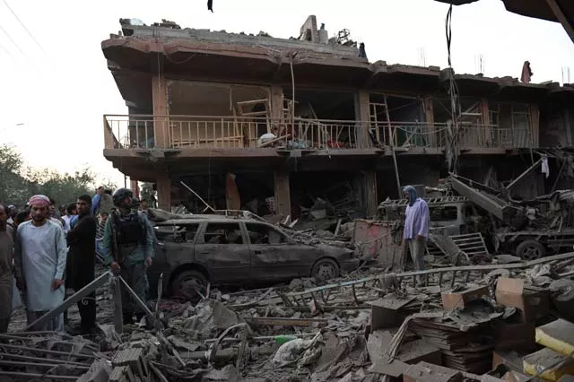 residents walk at a market destroyed by a powerful truck bomb in kabul on august 7 2015 photo afp residents walk at a market destroyed by a powerful truck bomb in kabul on august 7 2015 photo afp