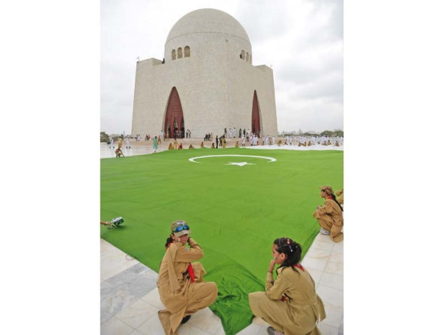 a large flag was spread outside the quaid s mausoleum on friday morning to mark the country s 69th independence day photo afp a large flag was spread outside the quaid s mausoleum on friday morning to mark the country s 69th independence day photo afp