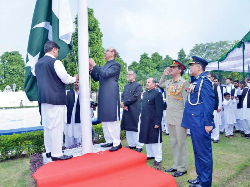 pakistan s high commissioner to india abdul basit hoists the national flag in new delhi photo inp online