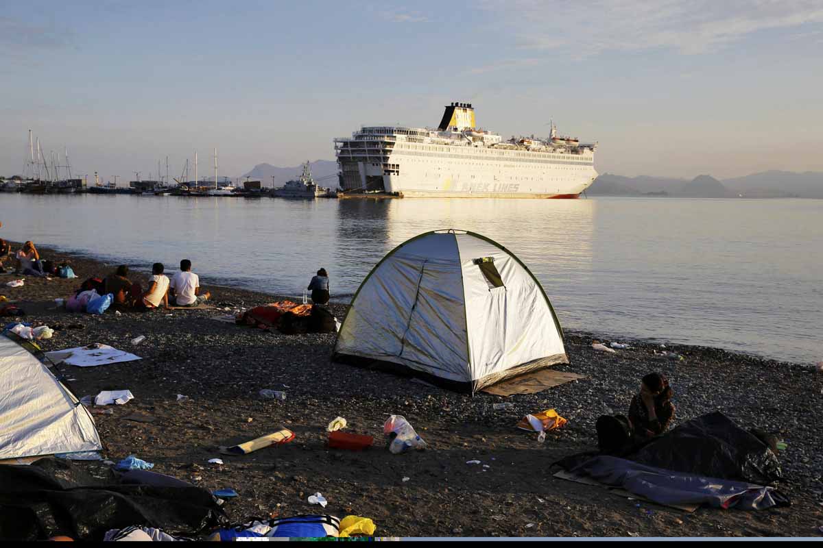 syrian refugees camp by the port as the passenger ship quot eleftherios venizelos quot is docked on the greek island of kos august 15 2015 the vessel will house more than 2500 migrants who arrived in the country from the turkish coast and will be used as a registration center for migrants photo reuters