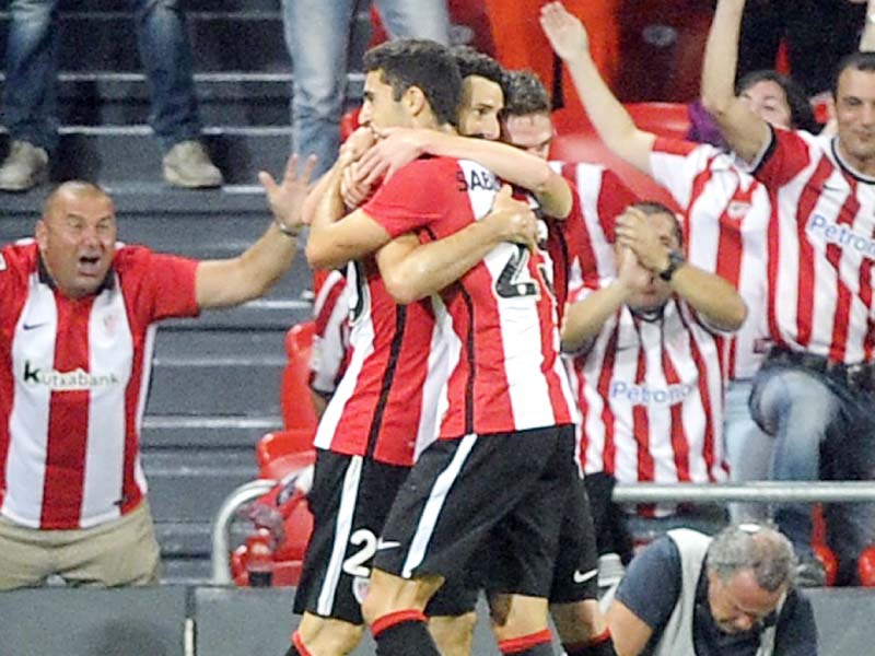 athletic bilbao s forward aritz aduriz completed a hat trick against barcelona to guide his team to a 4 0 win in the first leg photo afp
