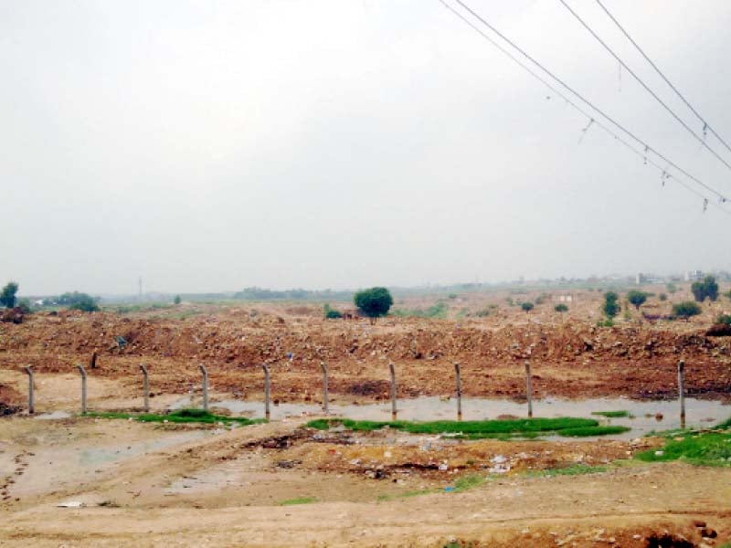 hundreds of homes once stood at the now levelled i 11 katchi abadi the site is now fenced and off limits to the public photo ebrahim umar khitab express