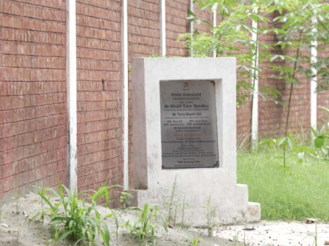 a plaque at the site shows that khalil tahir sindhu was scheduled to show up at the inauguration of the graveyard on may 24 2014 photo shafiq malik express a plaque at the site shows that khalil tahir sindhu was scheduled to show up at the inauguration of the graveyard on may 24 2014 photo shafiq malik express