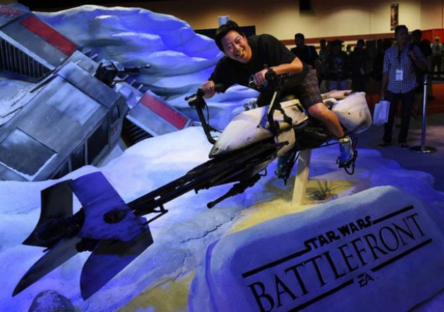 a disney fan rides a star wars display at the disney d23 expo 2015 in anaheim california august 14 2015 photo afp a disney fan rides a star wars display at the disney d23 expo 2015 in anaheim california august 14 2015 photo afp