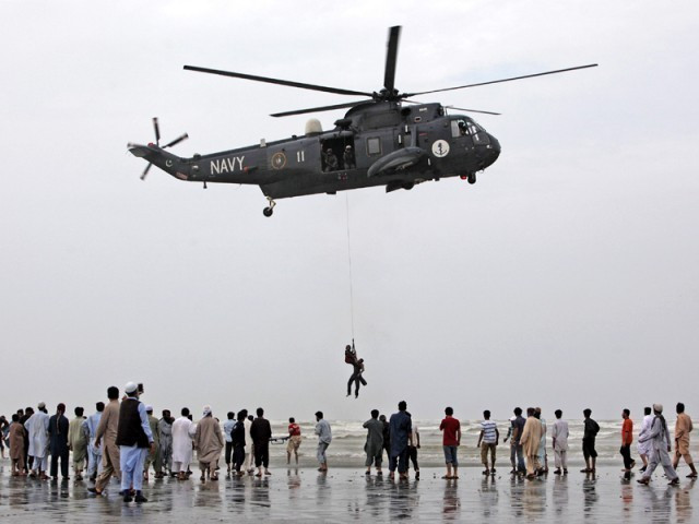 a pakistan navy helicopter carries out a search operation at clifton beach on august 1 2014 after 40 people drowned at different spots photo reuters a pakistan navy helicopter carries out a search operation at clifton beach on august 1 2014 after 40 people drowned at different spots photo reuters