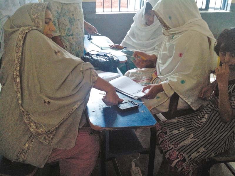 women take part in the polling process during by election in haripur photo express