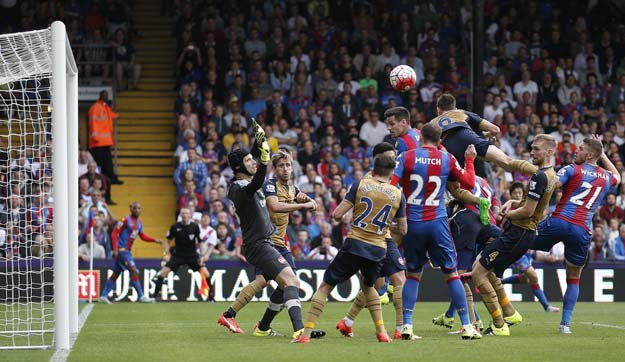 arsenal 039 s french defender laurent koscielny 3rd r jumps to clear the ball during the english premier league football match between crystal palace and arsenal at selhurst park in south london on august 16 2015 arsenal won the game 2 1 photo afp