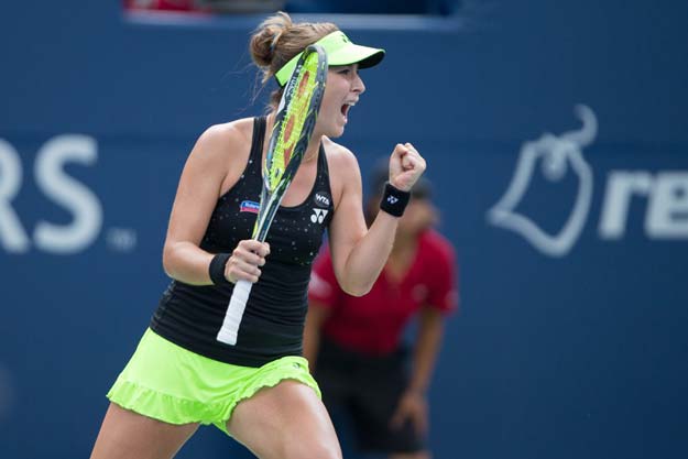 belinda bencic of switzerland celebrates her win in the first set tie breaker against simona halep of romania during their rogers cup tennis final at the aviva centre at york university in toronto canada on august 16 2015 photo afp