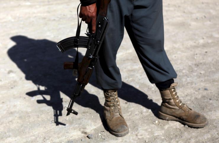 a german aid worker was kidnapped in kabul monday a senior afghani police official said in this photo dated july 2 2013 an afghan policeman with a weapon stands at the site of a suicide attack in kabul photo reuters