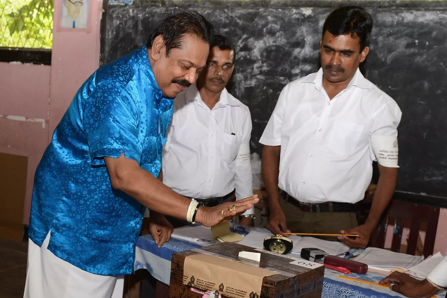 former sri lankan president and parliamentary candidate mahinda rajapakse casts his ballot at a polling station in his native town of tangalla about 195 kms from the capital colombo on august 17 2015 photo afp former sri lankan president and parliamentary candidate mahinda rajapakse casts his ballot at a polling station in his native town of tangalla about 195 kms from the capital colombo on august 17 2015 photo afp