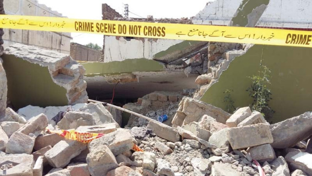 the late khanzada s dera lies in ruins a day after the suicide attack in attock photo azam khan express the late khanzada s dera lies in ruins a day after the suicide attack in attock photo azam khan express