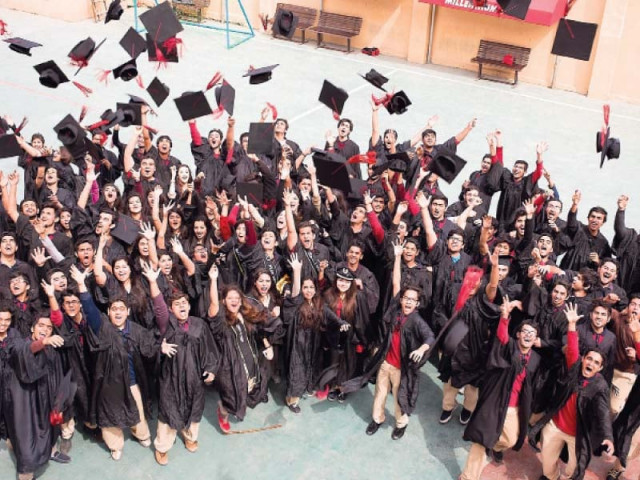 students throw their caps in the air for a photo after the graduation ceremony photo express students throw their caps in the air for a photo after the graduation ceremony photo express