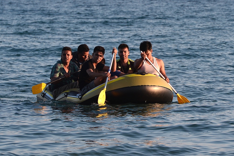 a group of migrants arrive to the shore of kos island on a small dinghy from turkey on august 18 2015 photo afp