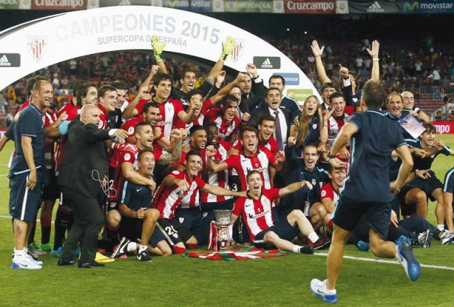 bilbao celebrate winning the spanish super cup but were only in the competition because barcelona had won both domestic competitions last season photo afp