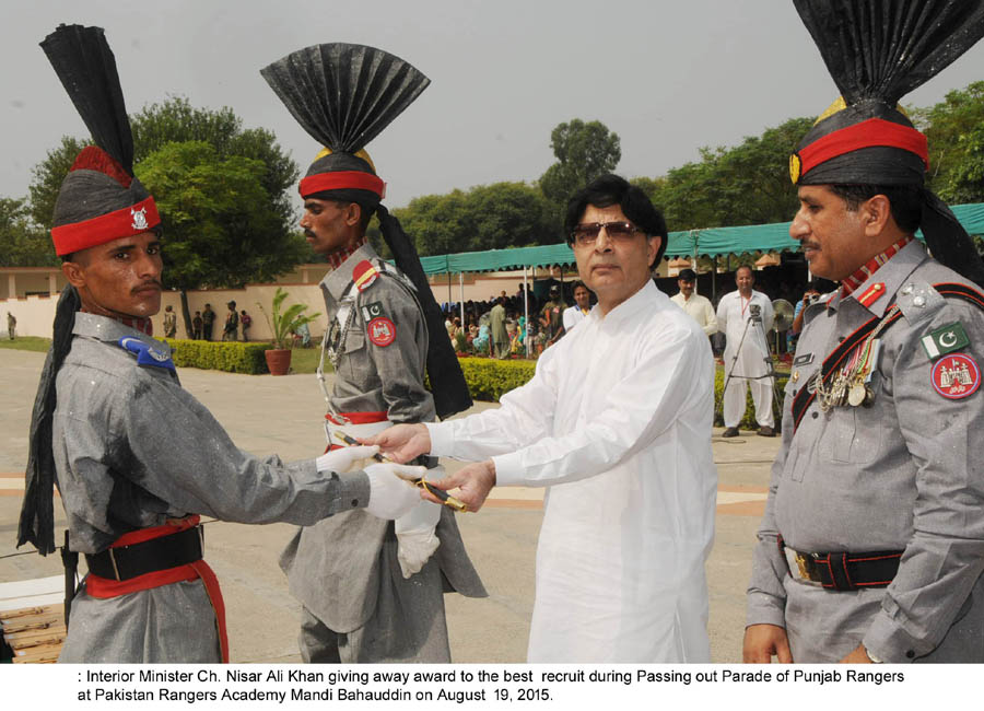 minister of interior chaudhry nisar ali khan gives award to the best recruit during passing out parade of punjab rangers at the punjab rangers academy in mandi bahauddin on august 19 2015 photo pid