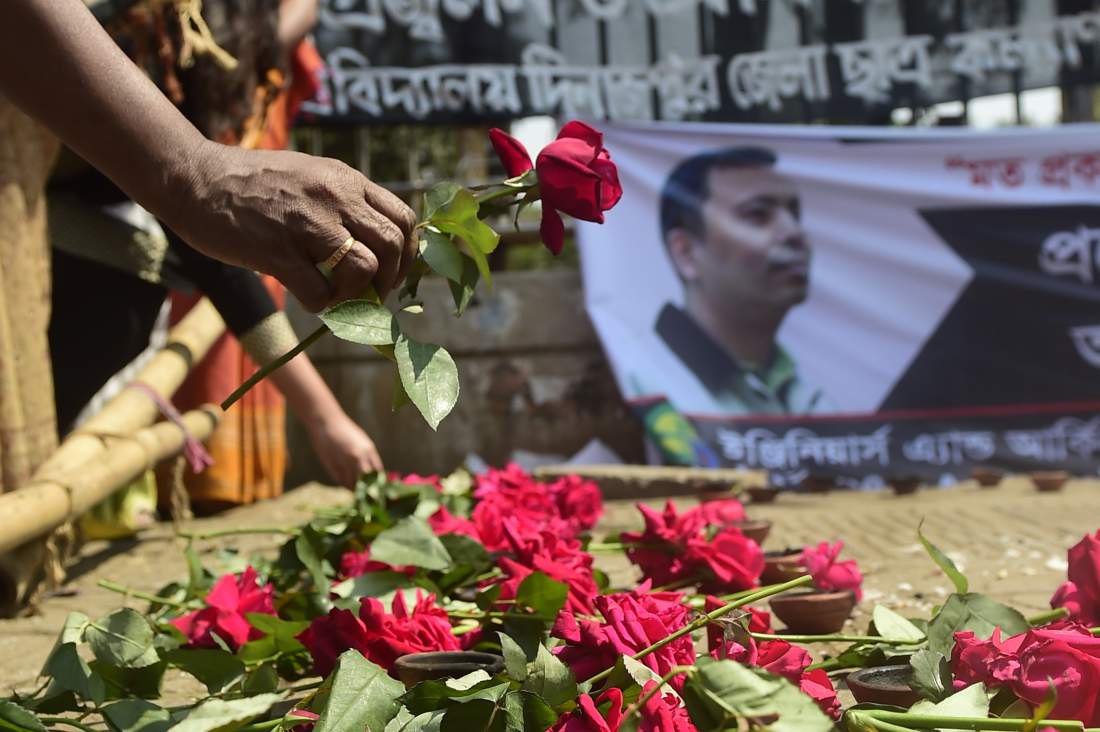 a bangladeshi social activist pays his last respects to slain us blogger of bangladeshi origin and founder of the mukto mona free mind blog site avijit roy in dhaka on march 6 2015 after he was hacked to death by unidentified assailants in the bangladeshi capital on february 26 photo afp