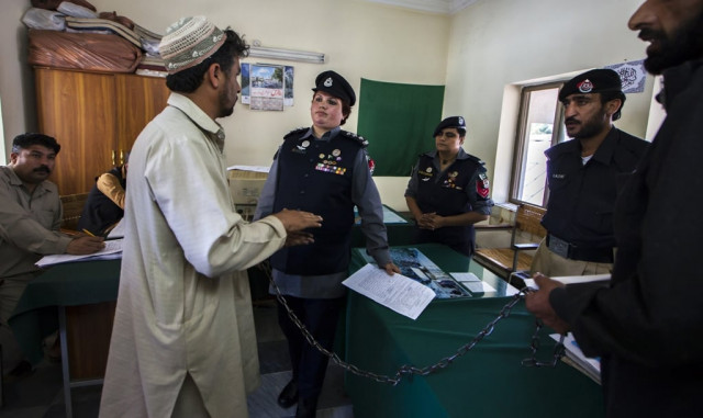 pakistani police inspector shazadi gillani interrogates an accused kidnapper at a police station in abbottabad photo reuters pakistani police inspector shazadi gillani interrogates an accused kidnapper at a police station in abbottabad photo reuters