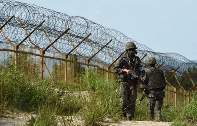 south korean soldiers keeping watch near the scene where planted landmines exploded on august 4 maiming two soldiers on border patrol in the demilitarized zone photo afp south korean soldiers keeping watch near the scene where planted landmines exploded on august 4 maiming two soldiers on border patrol in the demilitarized zone photo afp