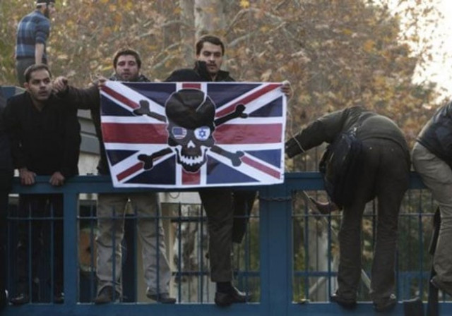 iranian protesters climb over the gate of the british embassy in tehran november 29 2011 photo reuters iranian protesters climb over the gate of the british embassy in tehran november 29 2011 photo reuters