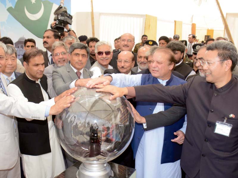 pm nawaz touches the first concrete pouring date plenum in a ceremony for the k 2 nuclear power project photo afp
