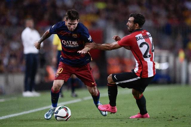 athletic bilbao 039 s mikel balenziaga r vies with barcelona 039 s lionel messi during the spanish super cup second leg football match on august 17 2015 photo afp athletic bilbao 039 s mikel balenziaga r vies with barcelona 039 s lionel messi during the spanish super cup second leg football match on august 17 2015 photo afp