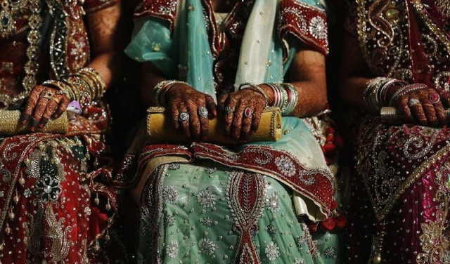 muslim brides wait for the start of their mass marriage ceremony in mumbai may 11 2014 photo reuters muslim brides wait for the start of their mass marriage ceremony in mumbai may 11 2014 photo reuters