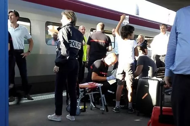 a police officer stands by as a passenger receives medical attention in arras northern france after being injured on august 21 2015 when a gunman opened fire on a train photo afp a police officer stands by as a passenger receives medical attention in arras northern france after being injured on august 21 2015 when a gunman opened fire on a train photo afp