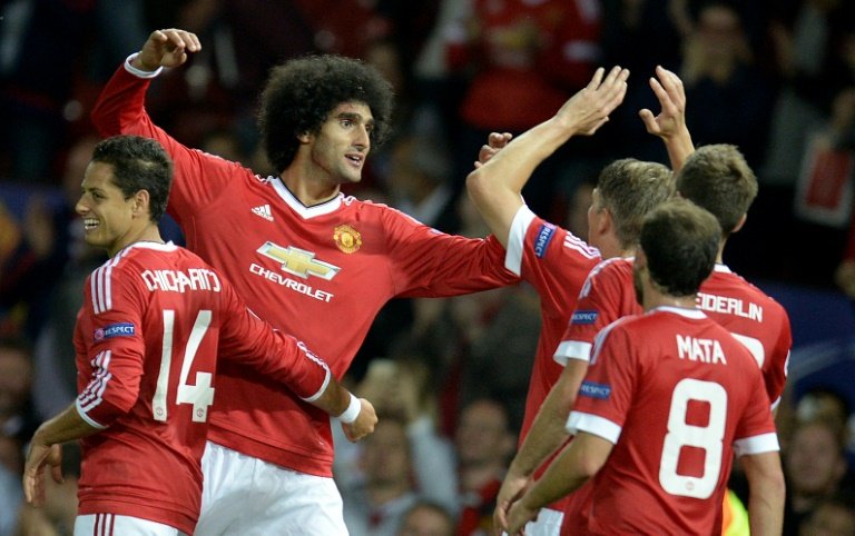 manchester united 039 s belgian midfielder marouane fellaini 2nd l celebrates with teammates after scoring a goal during their uefa champions league play off match against club brugge at old trafford in manchester on august 18 2015 photo afp