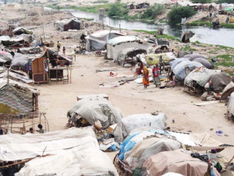 a large number of people live in the slums situated near lyari river speakers at an urban planning seminar said these slums are necessary as they house a majority of the city s population photo file