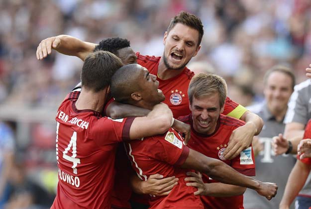 players of bayern munich celebrate after they scored the winning goal for their 2 1 victory photo afp