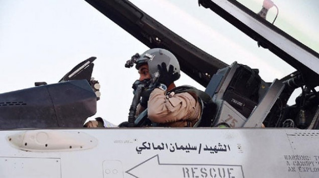 a pilot sitting in a cockpit of a fighter jet of the uae armed forces on the tarmac of a saudi air force base after raids against houthis in yemen photo afp a pilot sitting in a cockpit of a fighter jet of the uae armed forces on the tarmac of a saudi air force base after raids against houthis in yemen photo afp