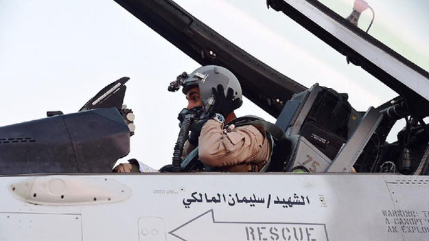 a pilot sitting in a cockpit of a fighter jet of the uae armed forces on the tarmac of a saudi air force base after raids against houthis in yemen photo afp