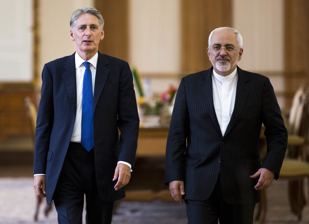 iranian foreign minister mohammad javad zarif l and his british counterpart philip hammond walk during a joint press conference in tehran on august 23 2015 photo afp