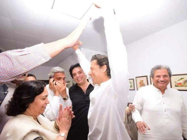 pti chief imran khan celebrates with party members after na 122 verdict photo express