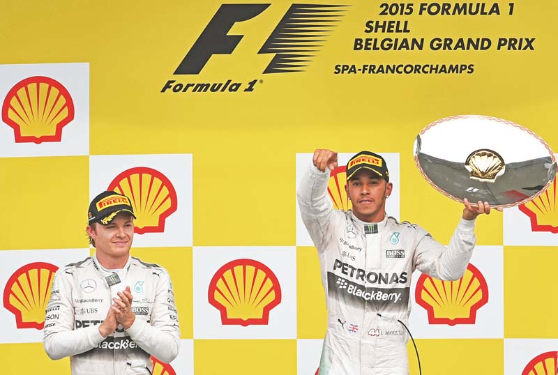 formula one world champion lewis hamilton won the belgian grand prix from pole position on sunday to stretch his lead over mercedes teammate nico rosberg to 28 points with eight races remaining photo afp