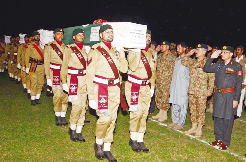 peshawar corps commander lt gen hidayatur rehman and other senior officers salute the martyred soldiers after their funeral photo pr