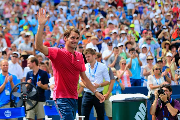 roger federer of switzerland celebrates after defeating novak djokovic of serbia to win the mens singles final at the western amp southern open at the linder family tennis center on august 23 2015 photo afp