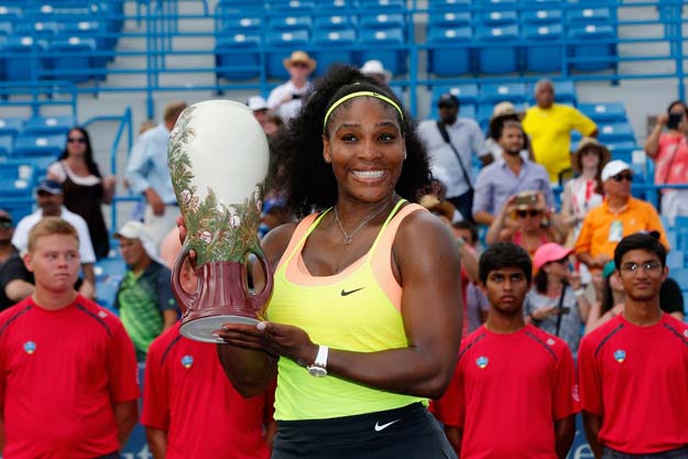 serena williams holds up the trophy after defeating simona halep of romania to win the womens finals of the western amp southern open at the linder family tennis center on august 23 2015 photo afp