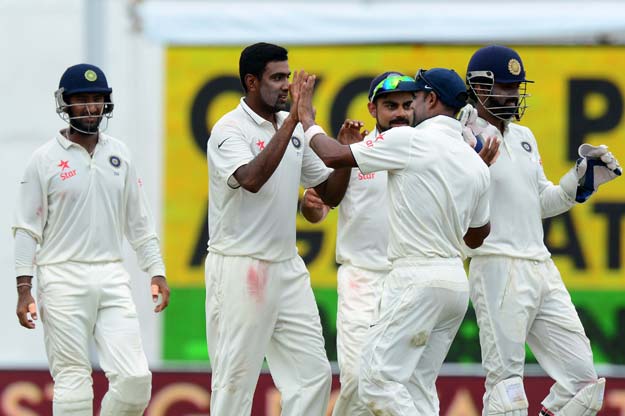 indian cricketer ravichandran ashwin 2l celebrates with his teammates after he dismissed sri lankan cricketer dinesh chandimal during the final day of the second test cricket match between sri lanka and india at the p sara oval cricket stadium in colombo on august 24 2015 photo afp